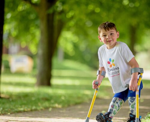 Tony Hudgell in the park on crutches