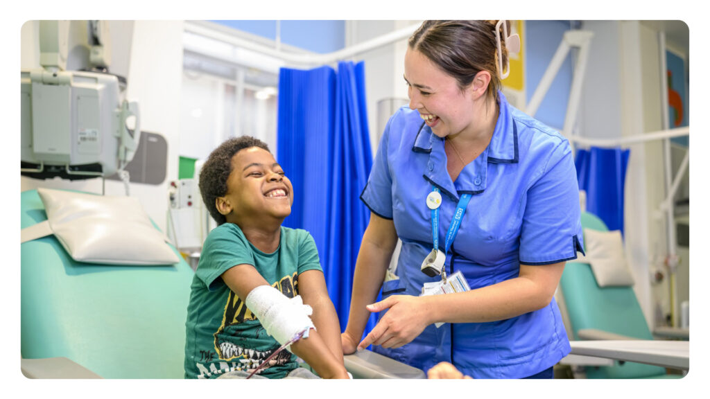 Image of a boy in a hospital bed next to a nurse