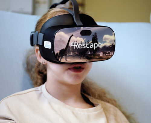 Girl wearing a VR headset that say