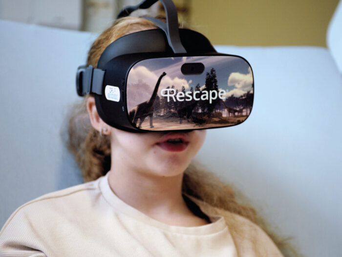 Girl wearing a VR headset that say
