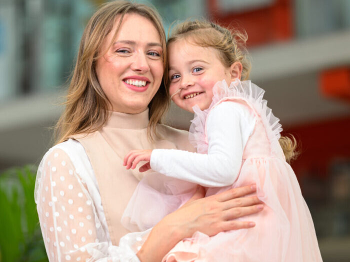 Laura holding her daughter Gloria in her arms at Evelina London.