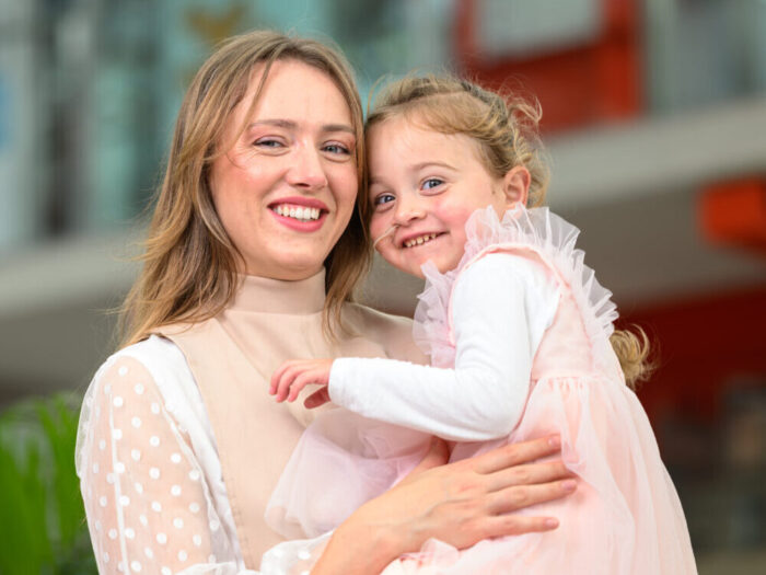 Laura holding her daughter Gloria in her arms at Evelina London.