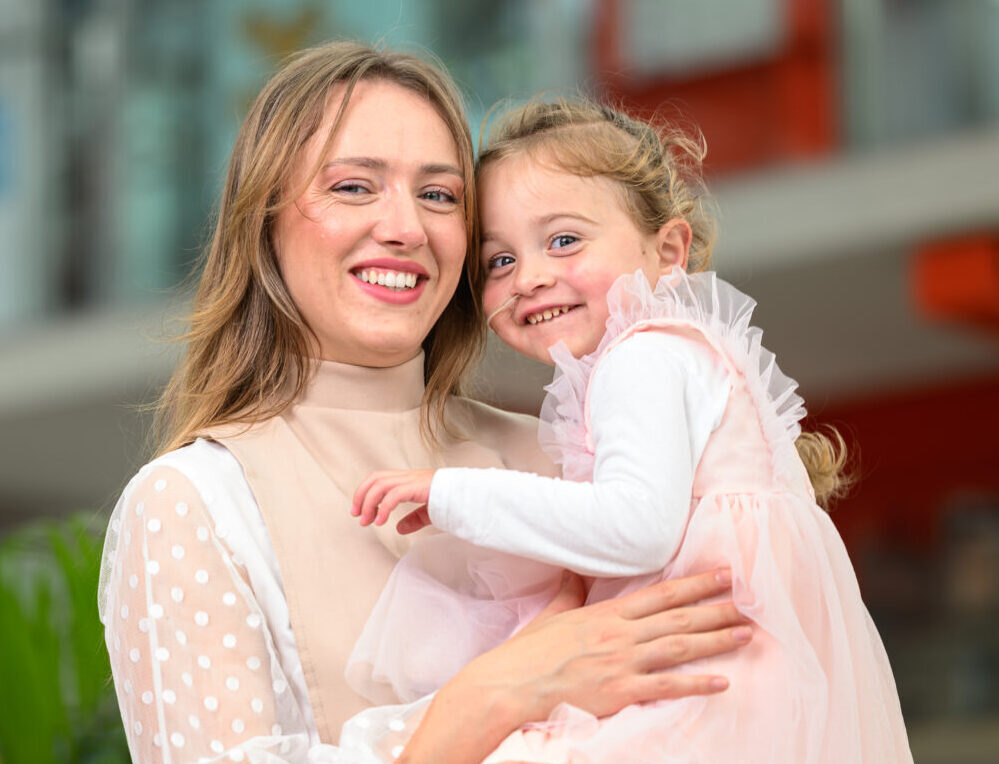 Laura holding her daughter Gloria in her arms at Evelina London.