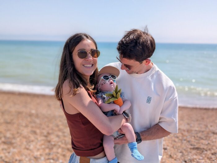 Alex and Serena at the beach with their baby Otis