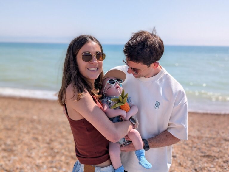 Alex and Serena at the beach with their baby Otis