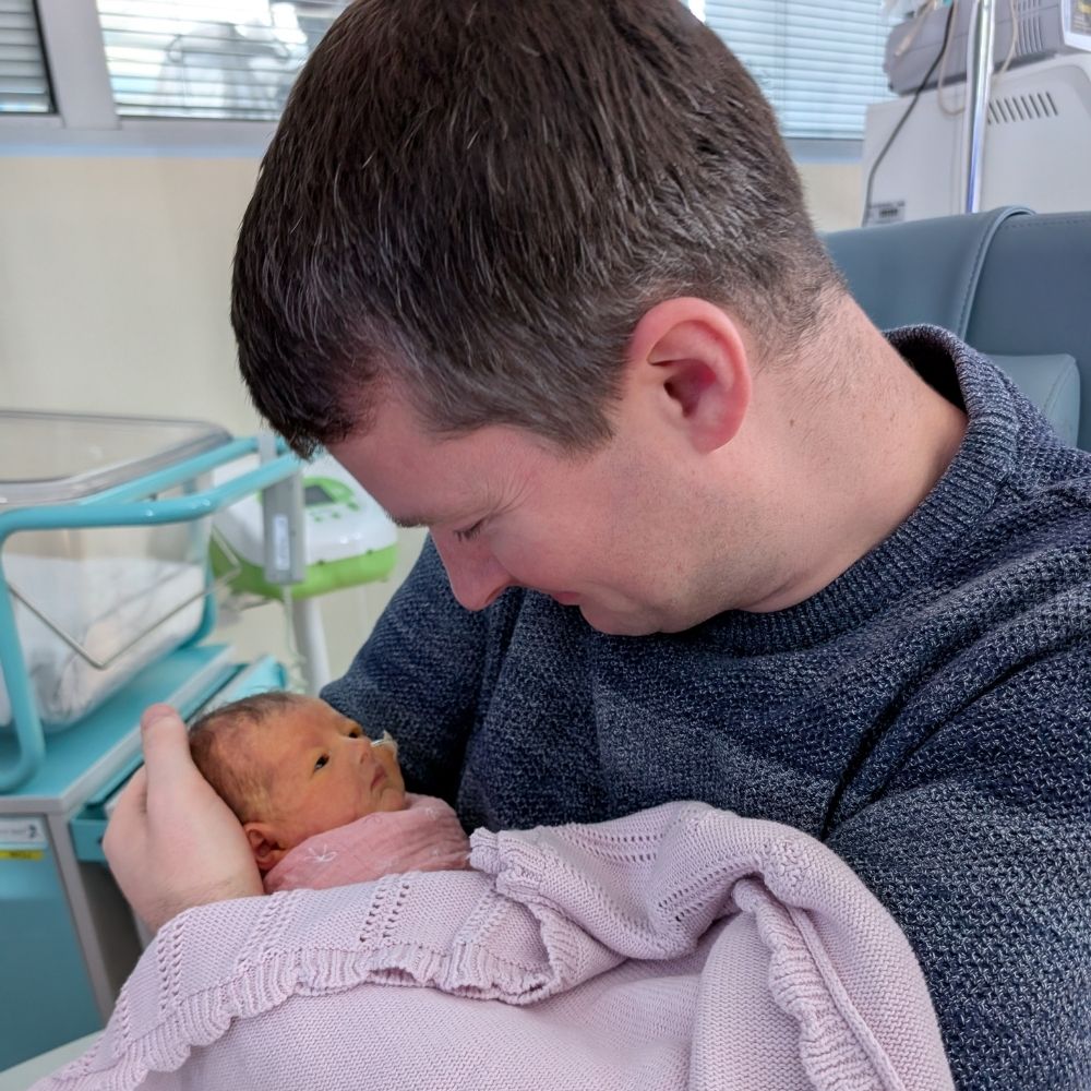Baby Ada being held by her dad, Nick at Evelina London Children