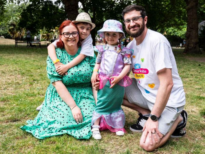 Holman family in the park before they take part in the Remarkable Race, they all appear to be smiling.