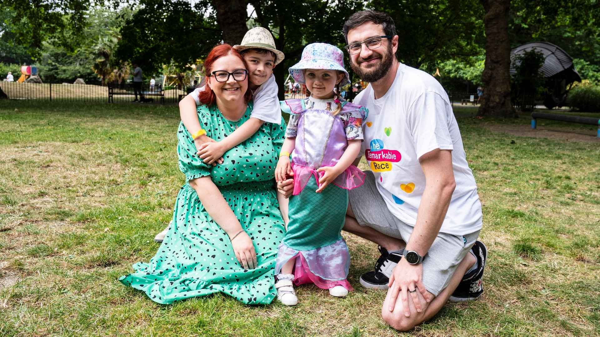 Holman family in the park before they take part in the Remarkable Race, they all appear to be smiling.